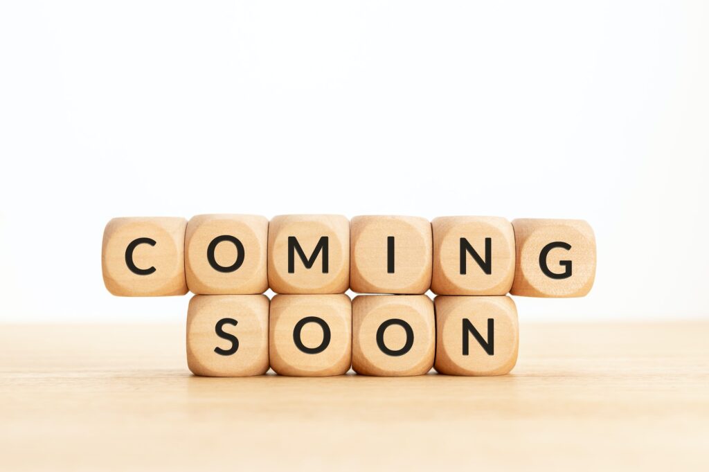 Coming soon phrase on wooden blocks